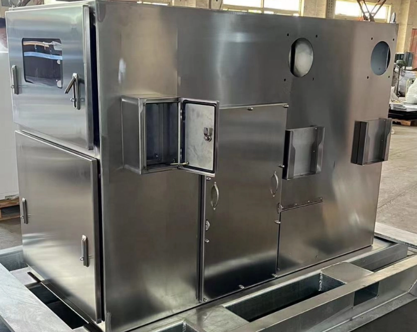 A stainless steel industrial equipment unit, featuring multiple compartments